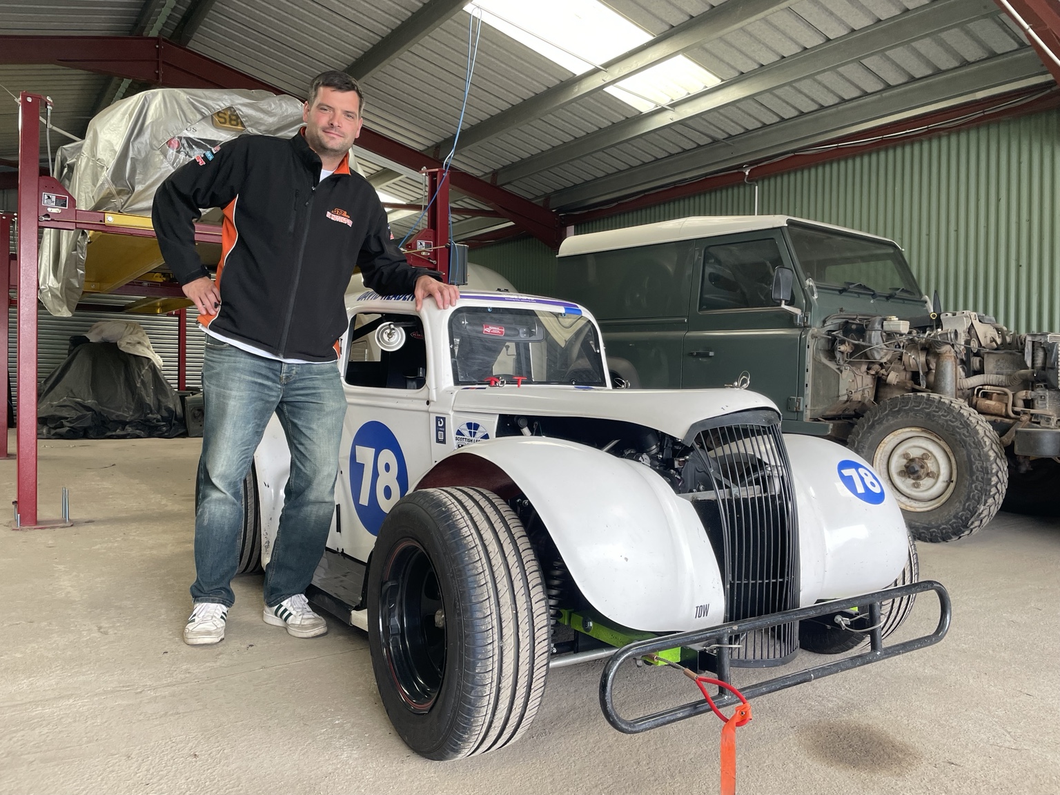 Steven standing beside his Legends car